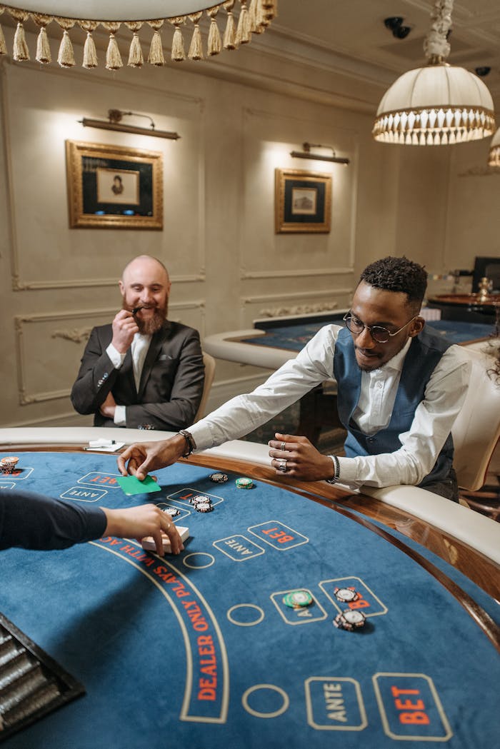 Two men engaging in a lively poker game at a luxurious casino table, capturing the thrill of gambling.